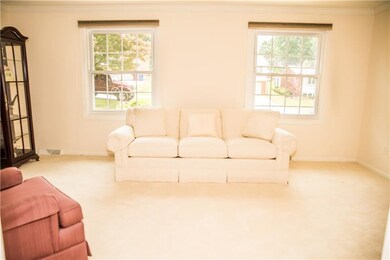 Large living room offers plenty of natural light.
