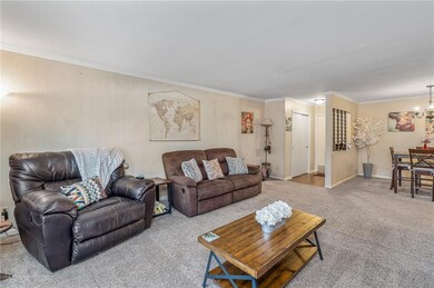 LIVING ROOM ENTRY WAY WIT WOOD FLOORS AND DINING A
