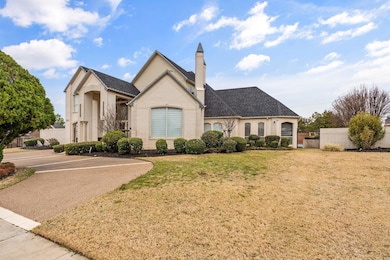 French country inspired facade featuring brick sid