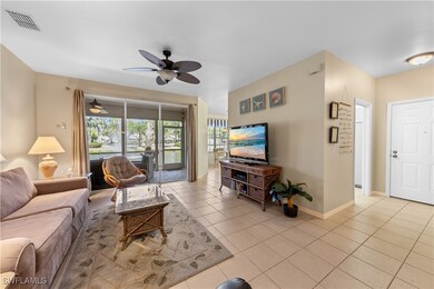 Living room featuring light tile patterned floorin