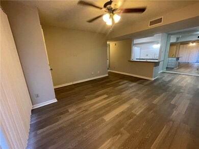 Unfurnished living room with dark hardwood / wood-