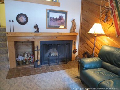 Living Room. Real, wood-burning fireplace with cus