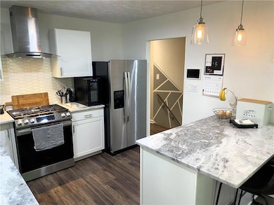 Kitchen featuring appliances with stainless steel 