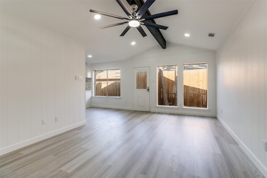 Unfurnished room featuring wood walls, wood finished floors, a ceiling fan, and recessed lighting