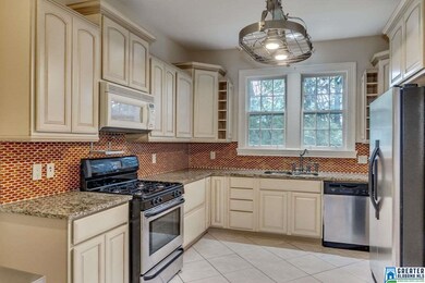 updated kitchen includes stainless steel appliance