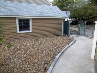 Exterior Front. Backyard path to garage