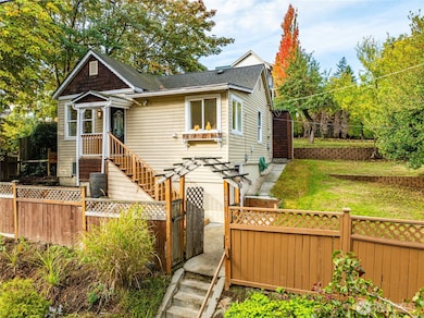 This lovely home is perched above the street and fully-fenced, to create an in-city oasis with ample space to play, garden, entertain, and unwind.