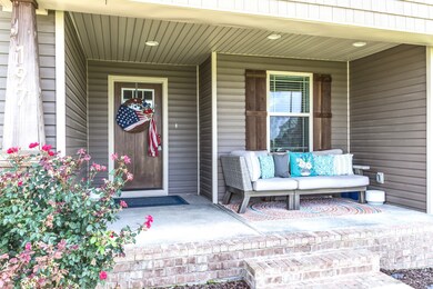 Welcoming covered front porch with recessed lighting