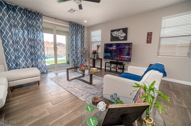 Living area featuring wood finished floors, recessed lighting, and ceiling fan