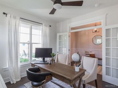 The entry offers an office w/ glass French doors,