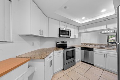 600 Uno Lago Dr unit 104, North Palm Beach, FL 33408 - photo 2