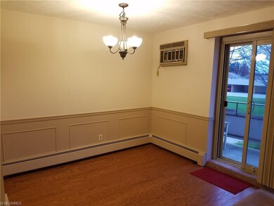 Dining room with sliding glass doors to balcony.