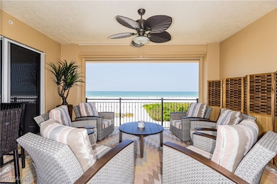 Balcony featuring a large outdoor living space, a gulf & beach view.