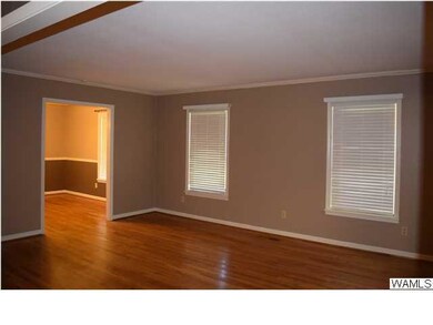 Spacious formal living room also has hardwood floo