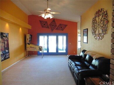 Family room with doors leading to covered patio