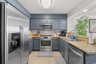 Kitchen with a sink, stainless steel appliances, d
