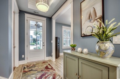 Foyer entrance with light hardwood / wood-style fl