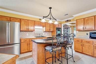 Beautiful cabinetry, 2 pantries, lots of counter space and a peninsula for cooking, serving, seating