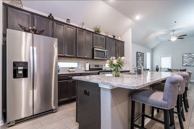 Gorgeous kitchen w/huge island and breakfast bar, granite counter-tops & stainless appliances!
