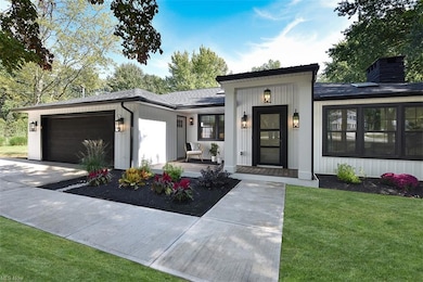 View of front of property featuring garage and a f