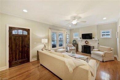 Spacious den with hardwood floors, fireplace and beautiful hearth. Beautifully decorated.