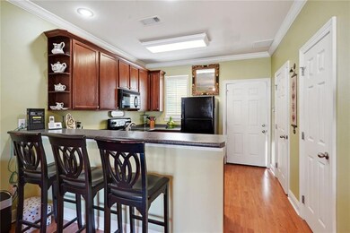 Kitchen with black appliances and granite counters