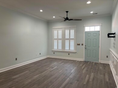 Entryway with ornamental molding, dark hardwood / 