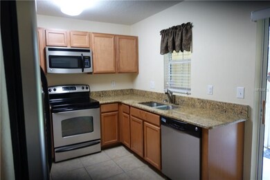 Kitchen with granite counter tops, maple wood cabi