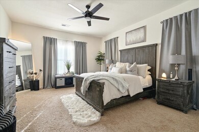 Bedroom featuring carpet floors and a ceiling fan