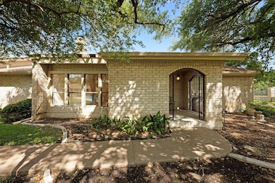 View of front facade featuring brick siding and a
