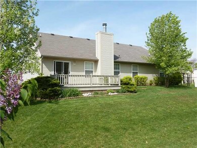 Exterior Back. Entertain friends on the wood deck overlooking this beautiful back yard, fully fenced so you can let the pets and kids run to their hearts desire.