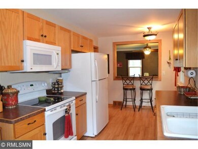 Galley style kitchen with breakfast counter