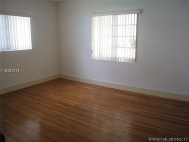 Front bedroom with solid wood floors & impact wind