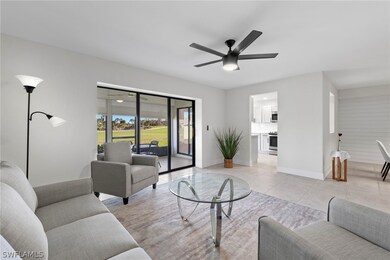 Living room featuring light tile patterned floorin