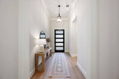 This inviting entrance hallway features a modern f