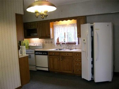 Kitchen. Modern appliances and lots of oak cabinet