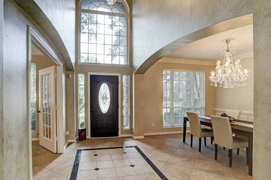 Two story entry beaming with natural light.