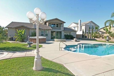 Resort like backyard with plenty of decking for lounging and entertaining