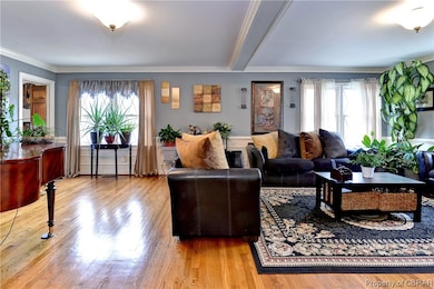 Living room featuring ornamental molding, a health