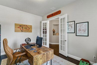 Office area featuring dark hardwood / wood-style f