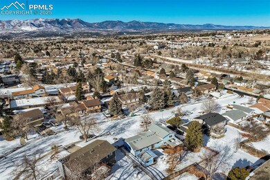 Snowy aerial view featuring a mountain view