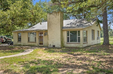 View of front facade featuring brick siding and a