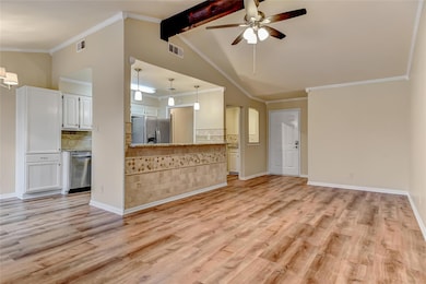 Unfurnished living room with visible vents, lofted