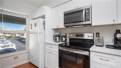 Kitchen with light hardwood / wood-style flooring,