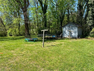 Large backyard with storage building