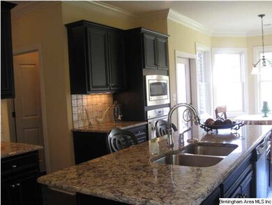 Kitchen with granite countertops, stainless steel 