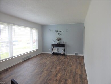 Enjoy the natural light that beams into the Living Room. High end Plantation Blinds allow for privacy and light control. All window treatments stay.