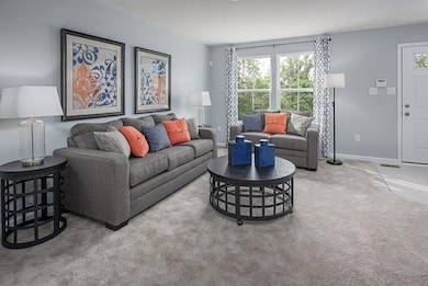 Spacious great room on the main level as your walk in with powder on the main level as well!   Huge space for your friends and family!  *Photo is from a 1220 Model.