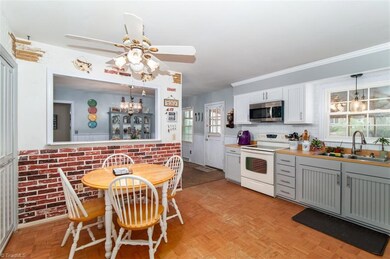Newly Updated Kitchen with new cabinet facing, soft close drawers and doors, New tile back splash.