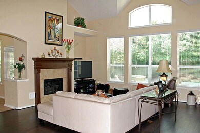 Soaring ceilings draw nature in plus provide peaceful water view.